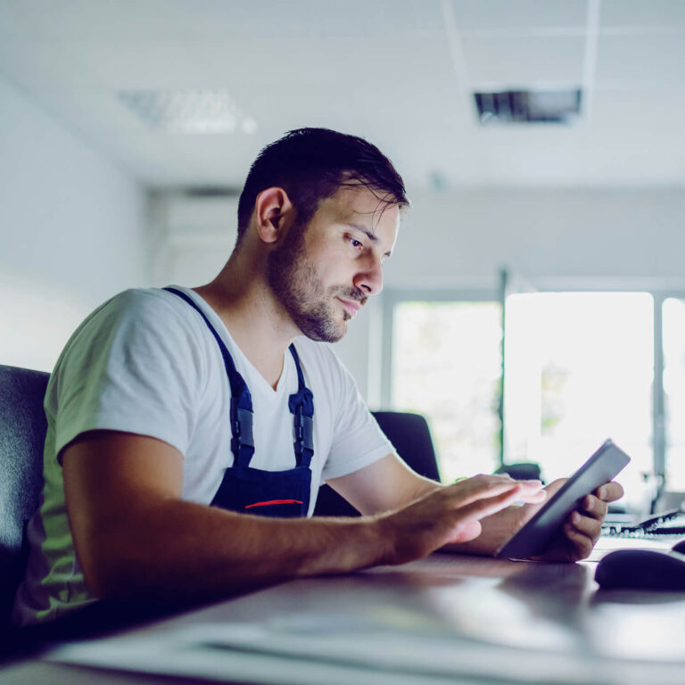man looking at tablet